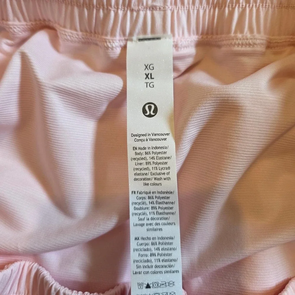 Lululemon Shake It Out High Rise Run Shorts in light baby pink pearl color